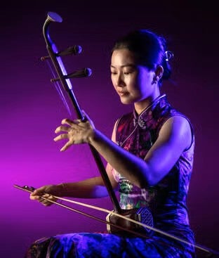 Chuan Qin playing the erhu.