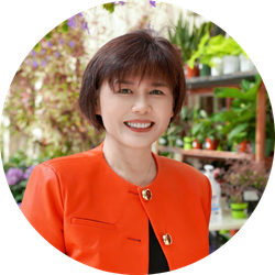 Kelly Chu wearing a red jacket and smiling