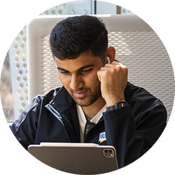 Online MBA student studying with laptop