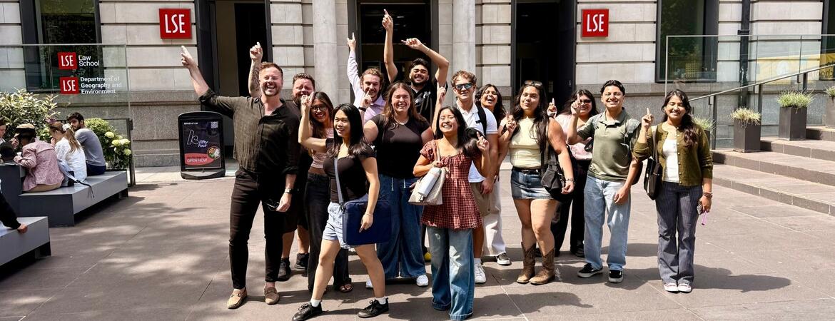 Kyle Ingram and his students posing in front of the London School of Economics campus