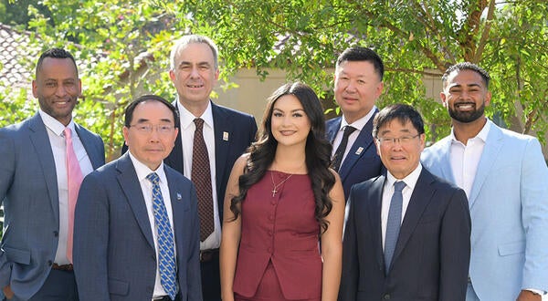 Damon Richardson, James Merino, Chancellor Jack Hu, Undergraduate student Shayla Michel, Michael Xu, Dean Yunzeng Wang, and undergraduate student Rhowen Raju
