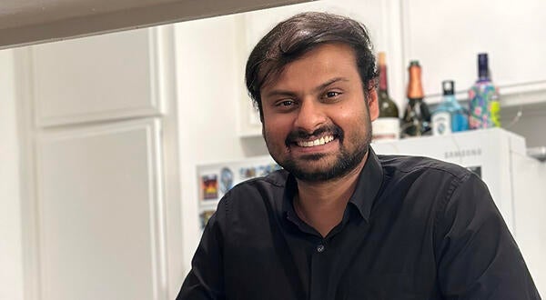 Adru in his kitchen, making cocktails