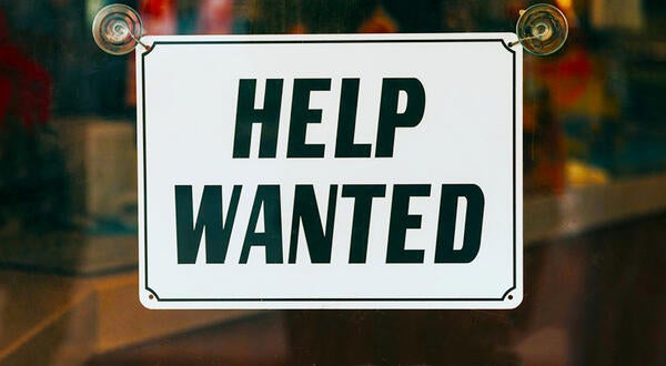 Help Wanted sign on window