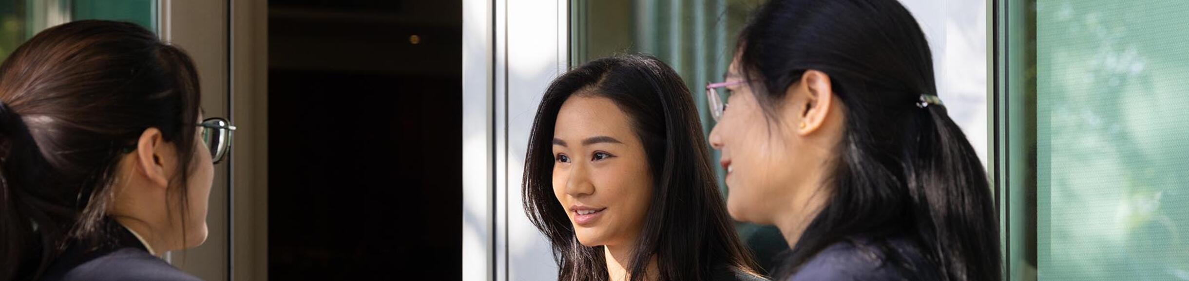 Three Students Talking