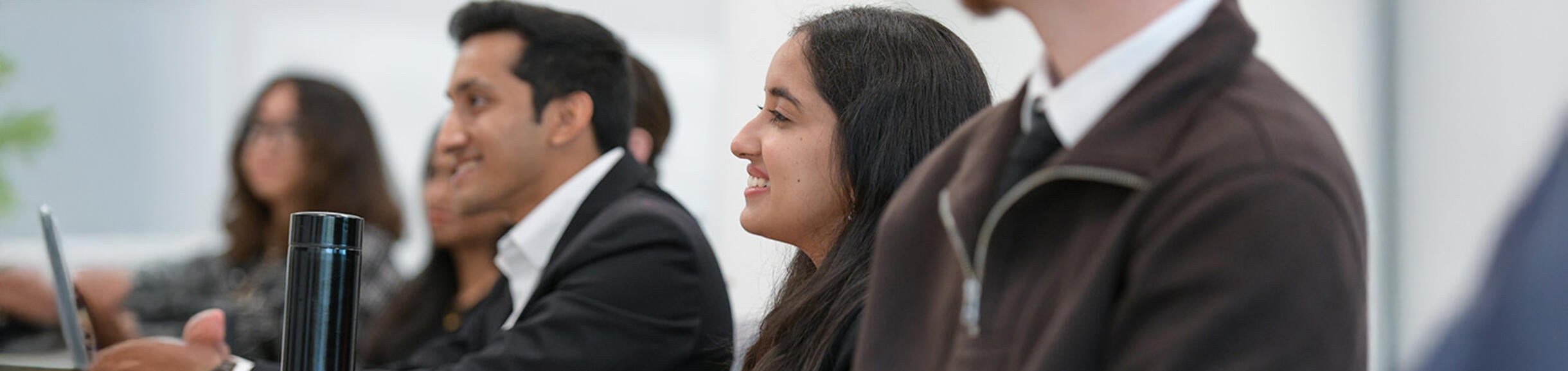 UCR Business student smiling during a class presentation