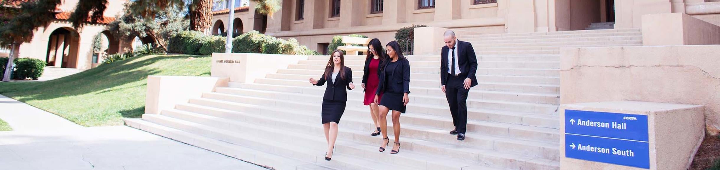 Business grad students on Anderson Hall stairs