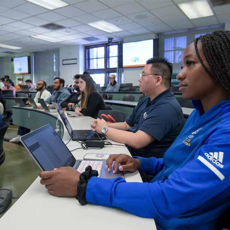 Graduate students in Anderson Hall classroom