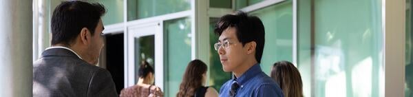 Two Male Students Talking