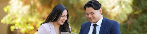 Actuarial Science, two students looking at laptop