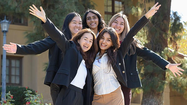 Undergraduate business students smiling