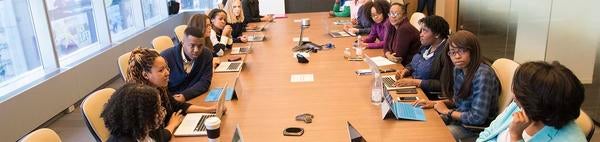 Conference table with employees