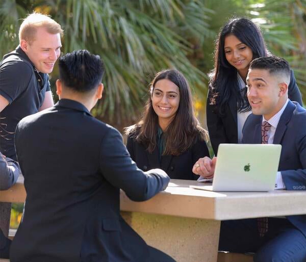 Grad students at Anderson Hall, UCR School of Business