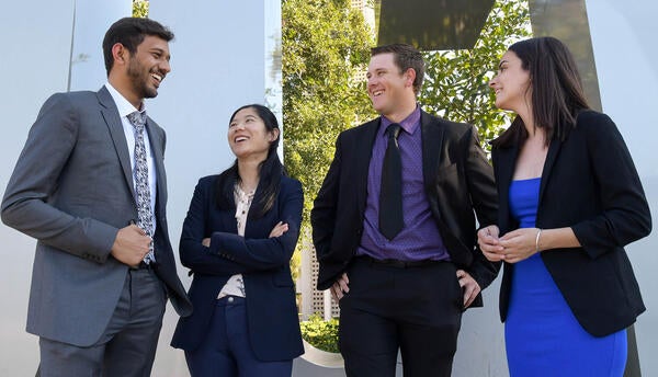 4 students in front of the ucr sign