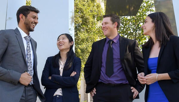 4 students in front of the ucr sign