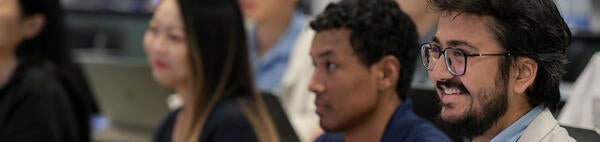 Graduate student attending a class in Anderson Hall, UCR School of Business