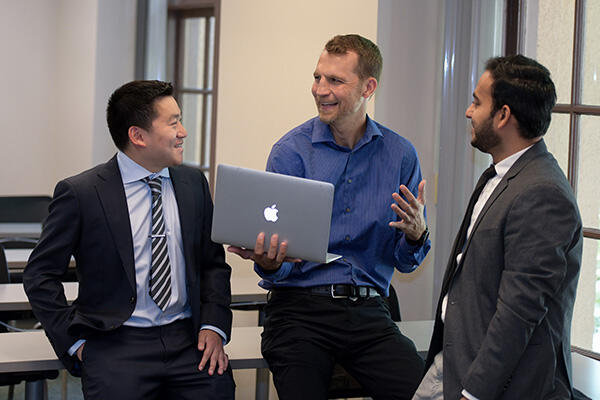 Professor Talking to students on computer