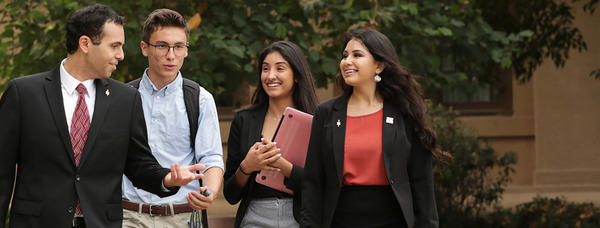 Students talking and walking outside