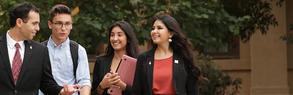 Students talking and walking outside