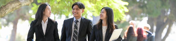 3 UCR Business undergraduate students at Olmsted Hall
