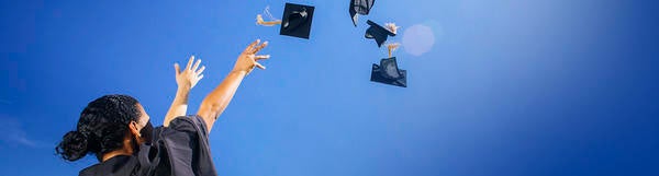 Graduation hats in the air