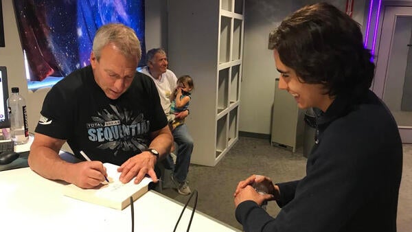 Dan BC signing his book for Alex Rodriguez in the tunnel