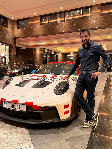 UCR School of Business Alumni Arun Surendra with Porsche