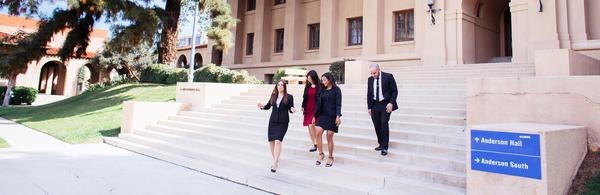 Business grad students on Anderson Hall stairs