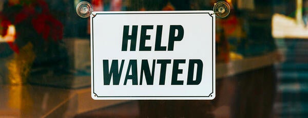 Help Wanted sign on window