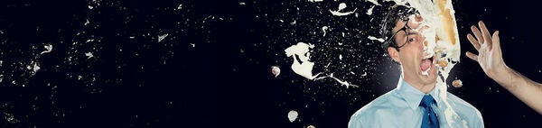 A business man gets pied in the face