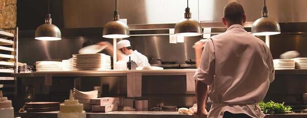 Cooks in restaurant kitchen