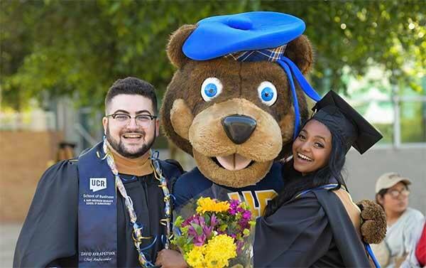 Scotty Highlander and 2 UCR School of Business graduates