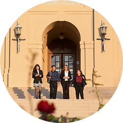 Students walking down the stairs of Anderson Hall, UCR School of Business