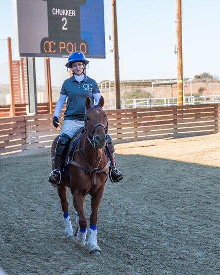 Marlo Raveendran, assistant professor of management, playing polo Marlo Raveendran, assistant professor of management, playing polo