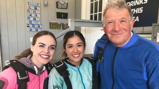 UCR Business staff members Abigal Wheeeler and Maribel Segura, just before their tandem skydives, with Rami Zwick, Associate Dean for Graduate Programs, and an experienced skydiver UCR Business staff members Abigal Wheeeler and Maribel Segura, just before their tandem skydives, with Rami Zwick, Associate Dean for Graduate Programs, and an experienced skydiver