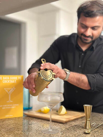 Nithin Adru mixing a cocktail