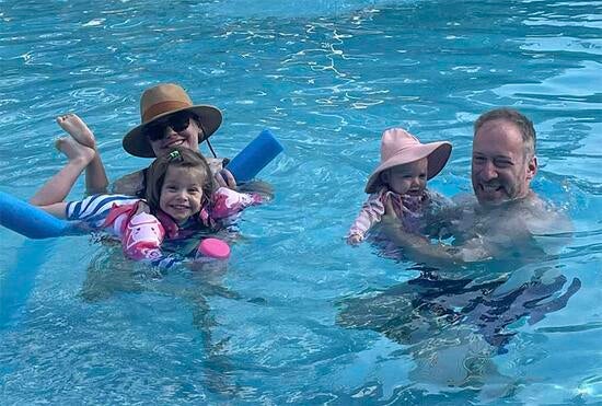 Scott Ganz and family in a swimming pool Scott Ganz and family in a swimming pool
