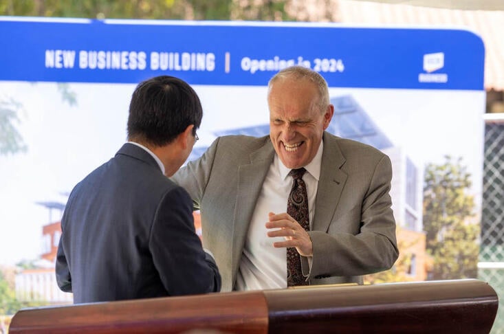 School of Business Dean Yunzeng Wang and Chancellor Kim. A. Wilcox at the groundbreaking ceremony