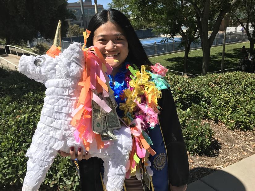 Michelle Phan, holding her unicorn money piñata, on Saturday, June 12, 2021. (UCR/Sandra Baltazar Martínez)