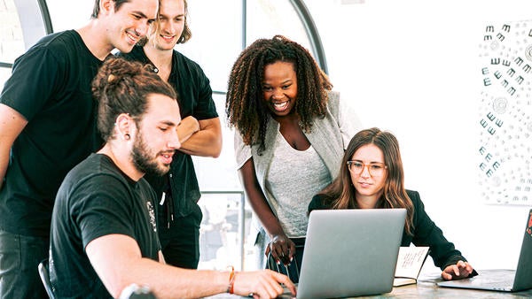 ABLE group of students looking at a laptop group of students looking at a laptop